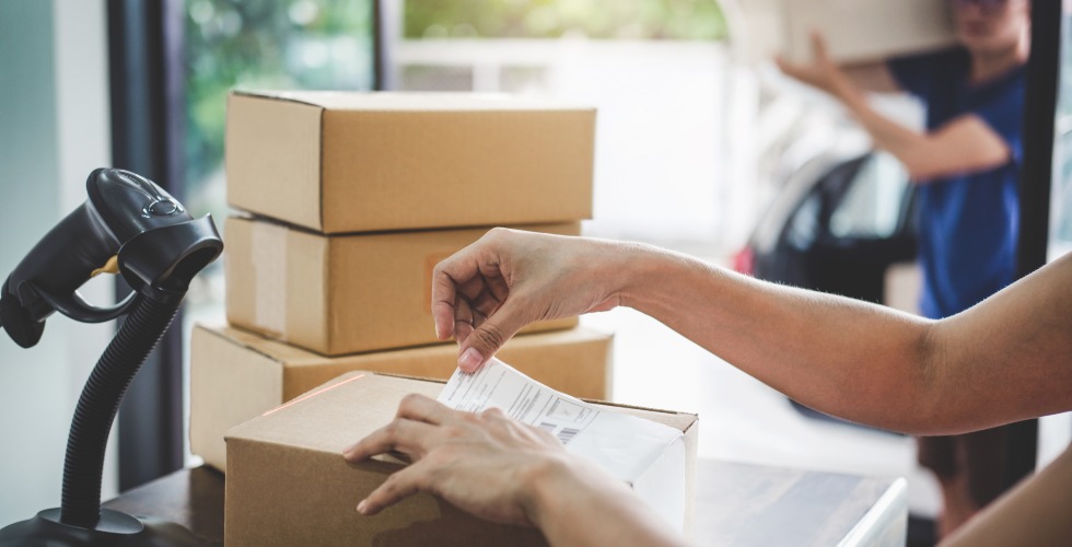 retail worker scanning deliveries